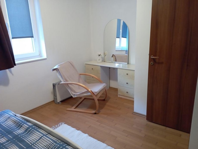 Bedroom with seating area and dressing table