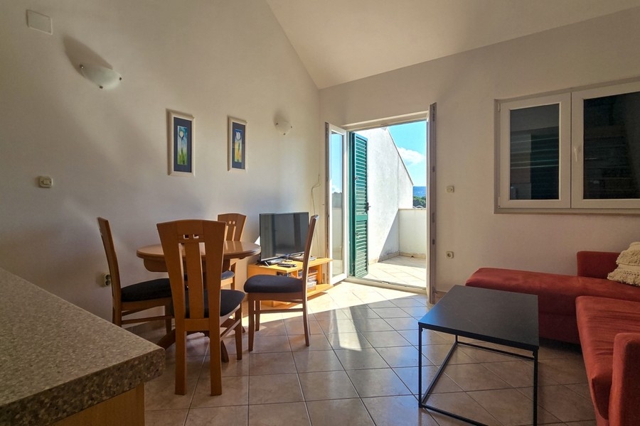 Living room with balcony access and lots of natural light