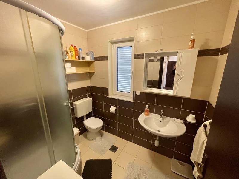 Bathroom with shower, toilet and sink