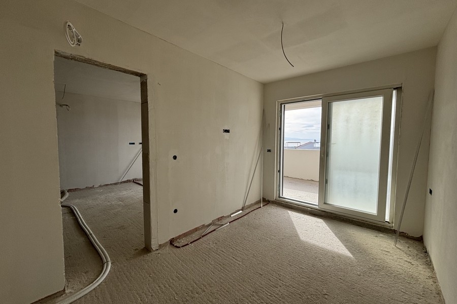 Bedroom in unfinished condition with window opening