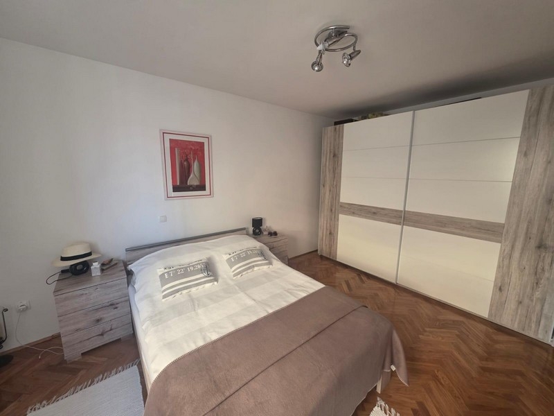 Bathroom with shower, washing machine and window