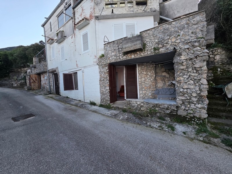 Exterior view of a traditional stone house in a coastal location