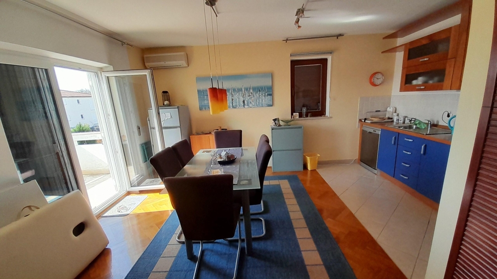 Open living and kitchen area with modern furnishings