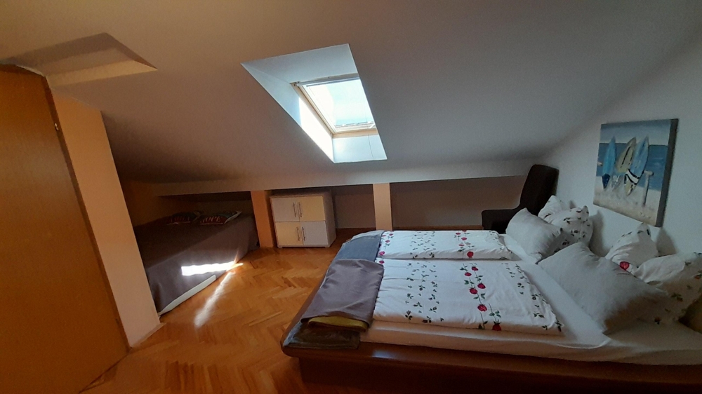 Attic bedroom with skylight