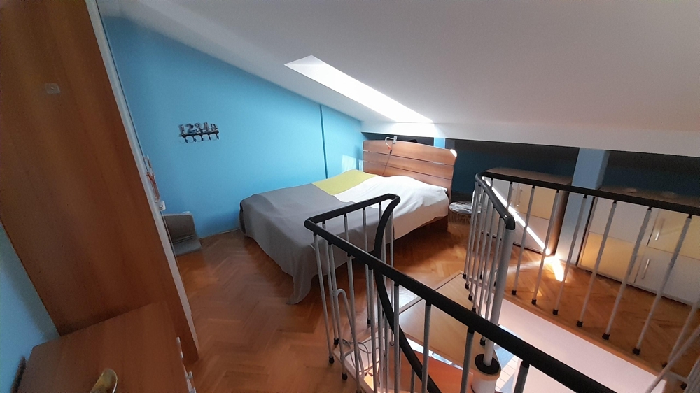 Another bedroom in the attic with a gallery feel