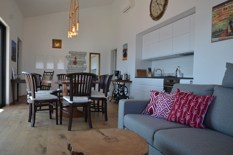 Open living area with kitchen and dining table