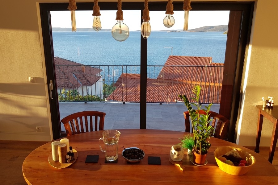 Dining area with sea views and large window front