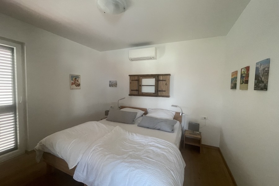 Bedroom with double bed and air conditioning