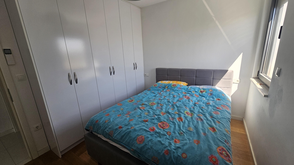 Bedroom with built-in wardrobe and double bed