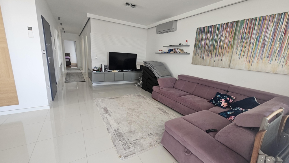 Open living area with sofa and TV