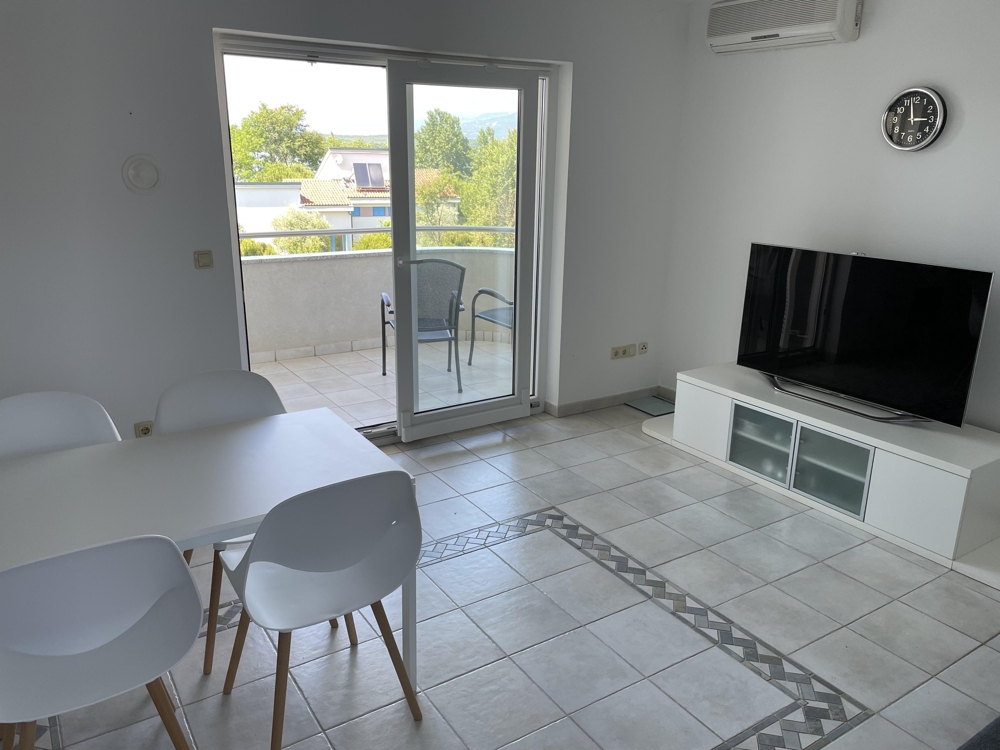 Balcony access with sea views through large window front