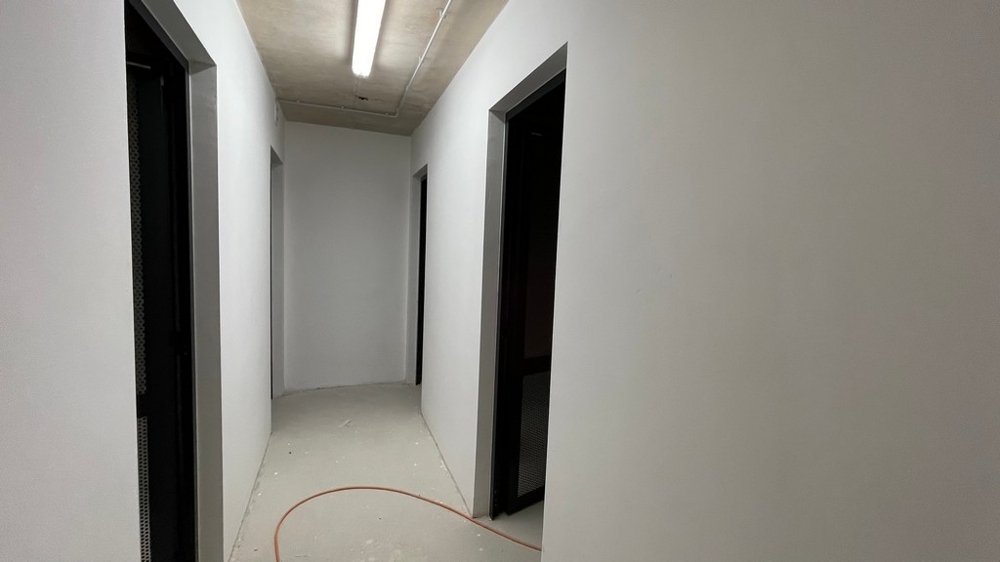 Basement hallway with access to the storage rooms