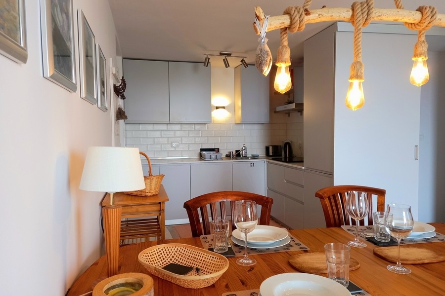 Dining room with balcony access and sea views
