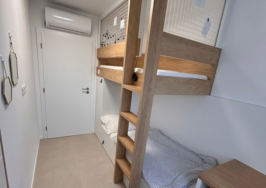 Bedroom with bunk bed and storage space