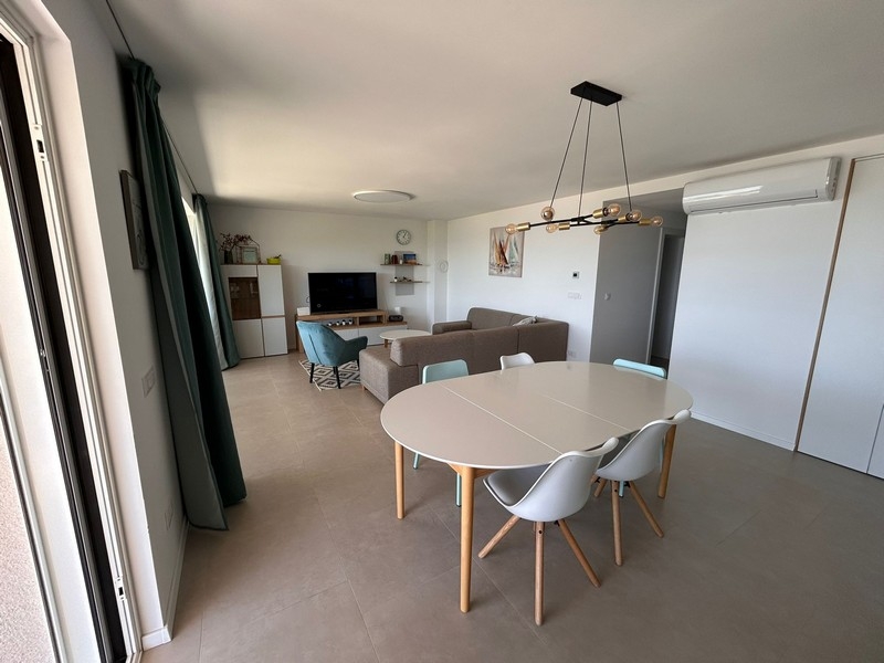Modern living and dining area with air conditioning
