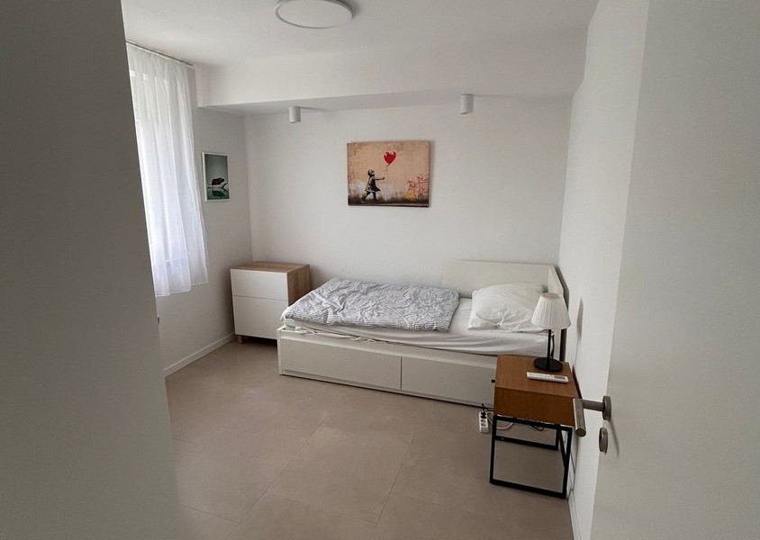 Bedroom with single bed and window