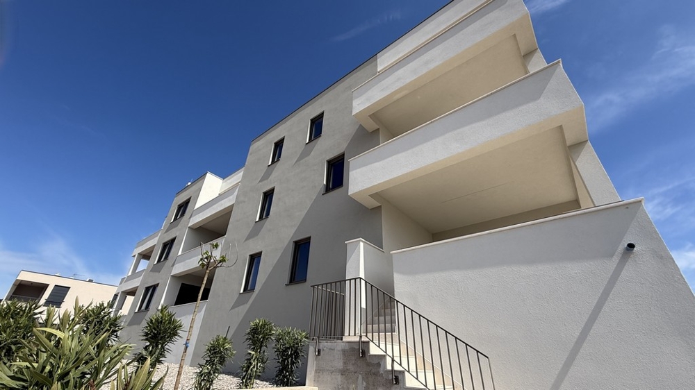 View of the building with a modern facade and spacious balconies