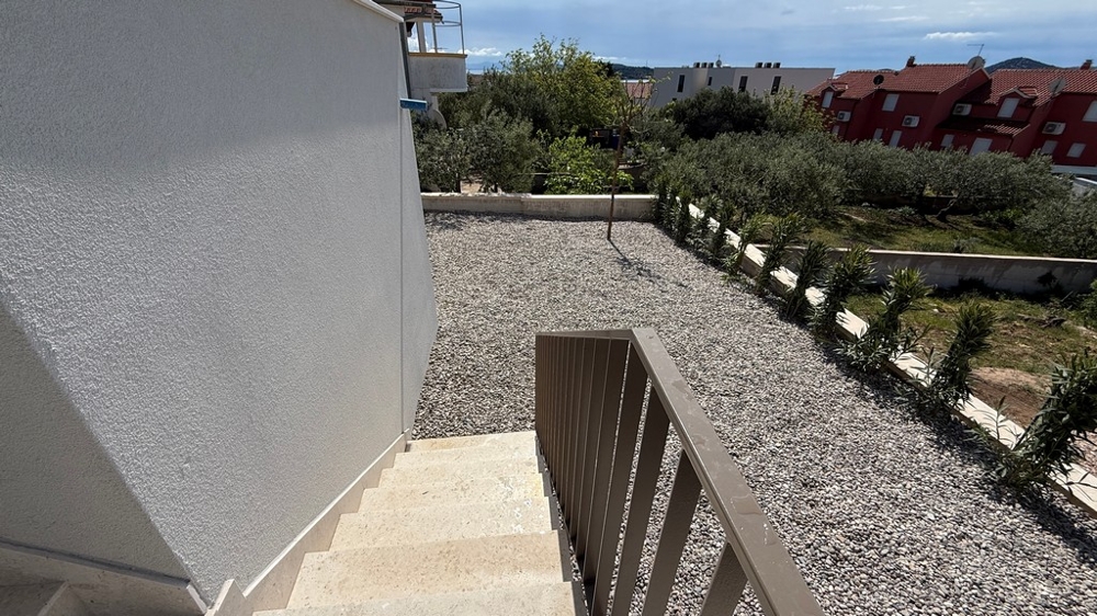 Stairs to private garden with gravel area