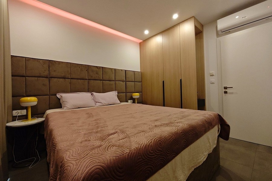 Bedroom with built-in wardrobe and air conditioning