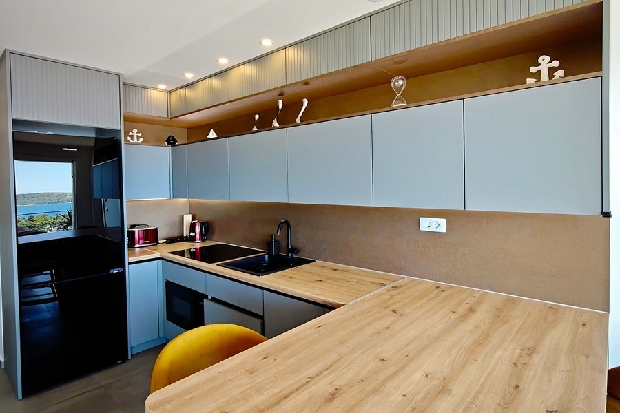 Open kitchen with counter and bar stools