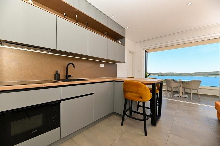 Kitchen with work surface and sea view
