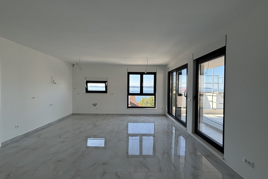 Living area with large windows and sea views