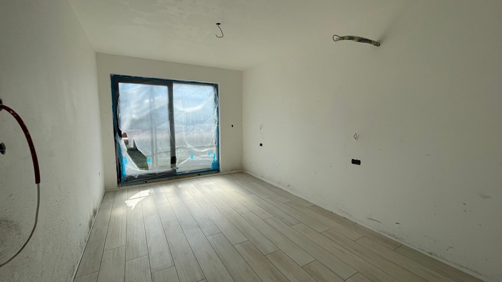 Another bedroom with a generous window front