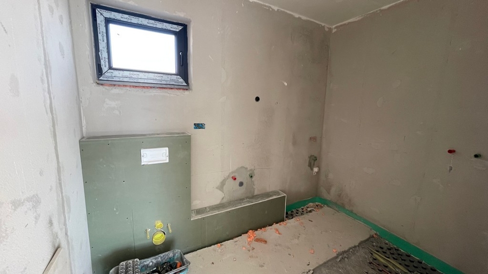Bathroom under construction with prepared connections