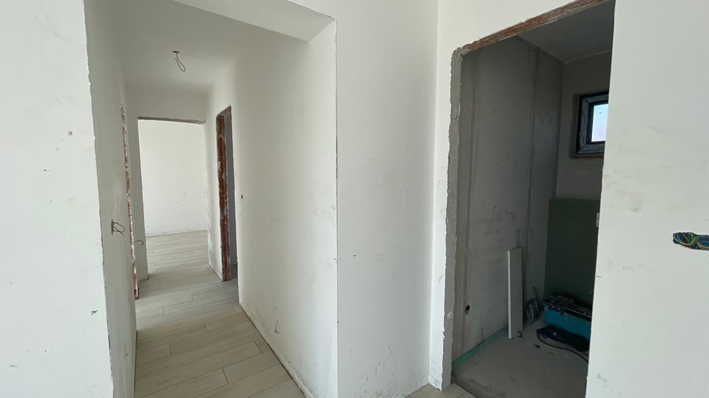 Hallway with access to several rooms in the apartment