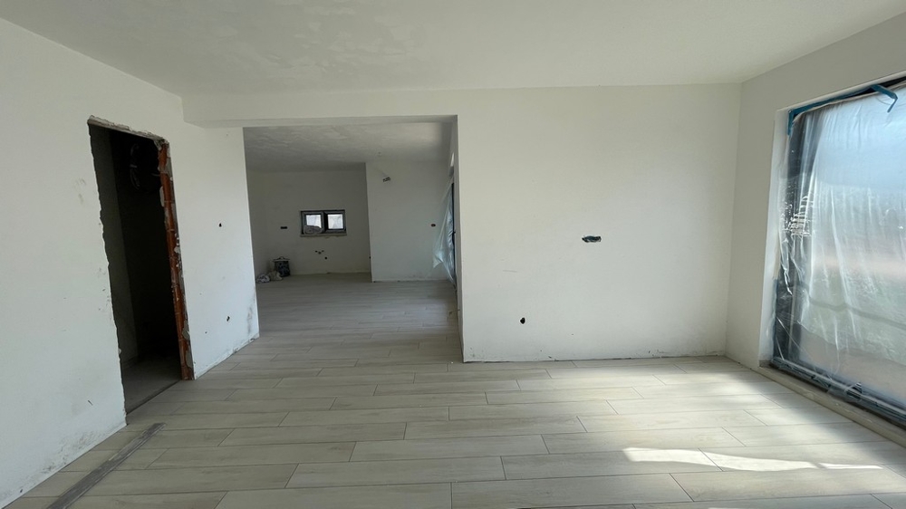 Open living room with lots of daylight and a modern layout