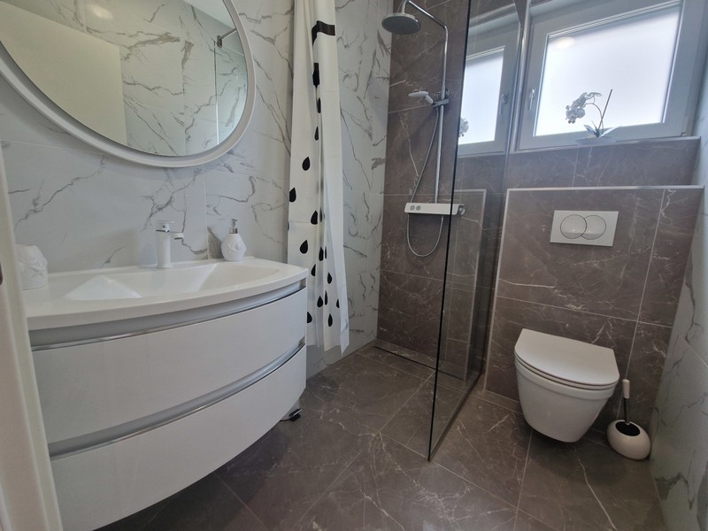 Modern bathroom with floor-level shower