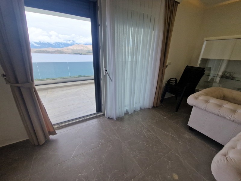 Living room with panoramic windows and sea views