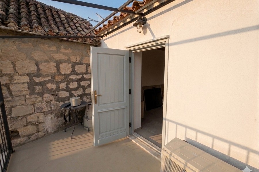 Terrace on the upper floor of a stone house