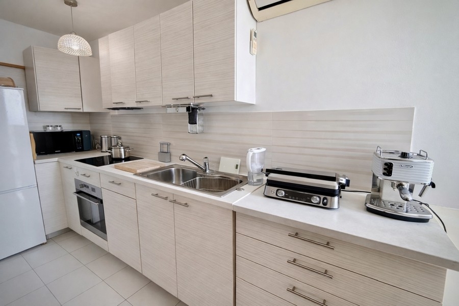 Modern kitchen of the apartment with built-in appliances