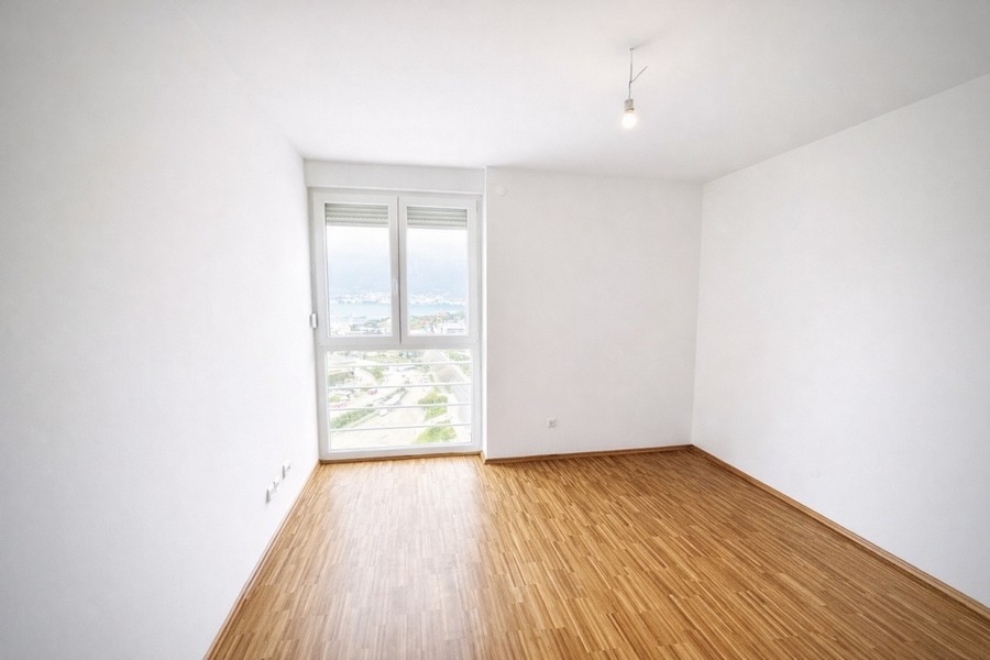Bright room with sea and city views