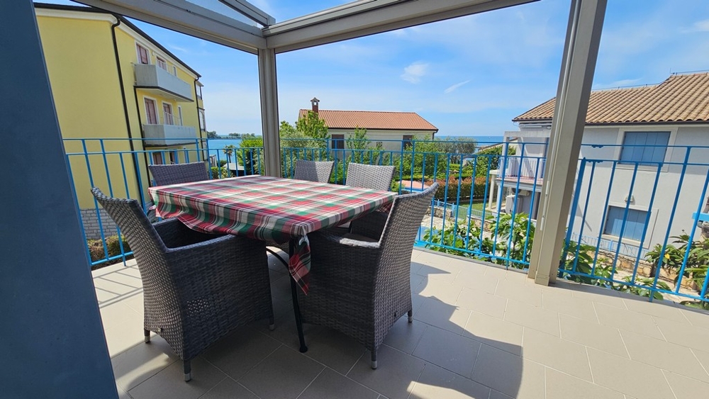Terrace with seating area and sea views
