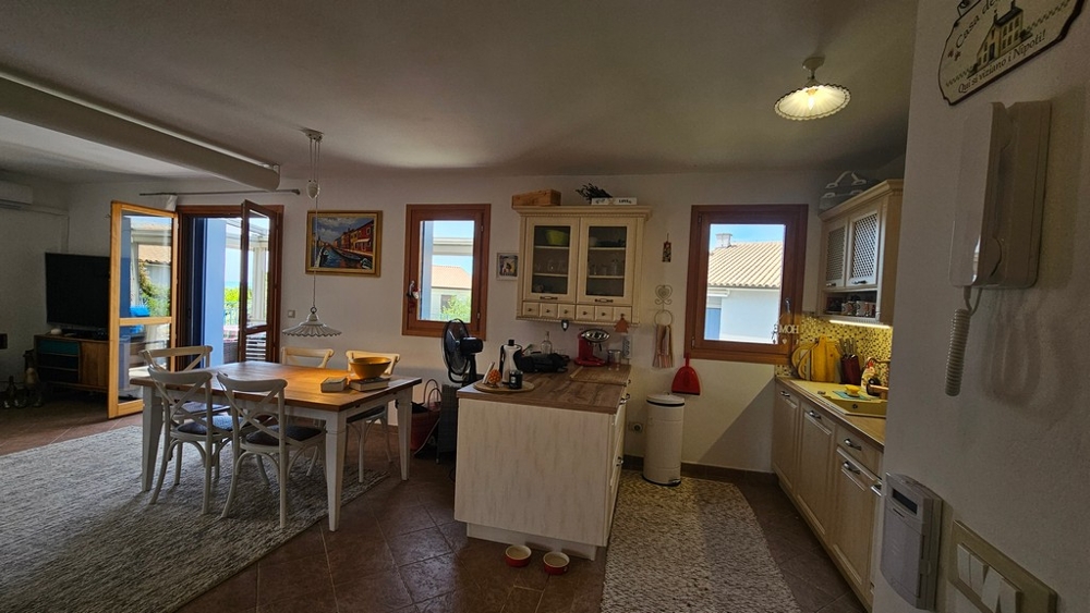 Living and kitchen area with sea views