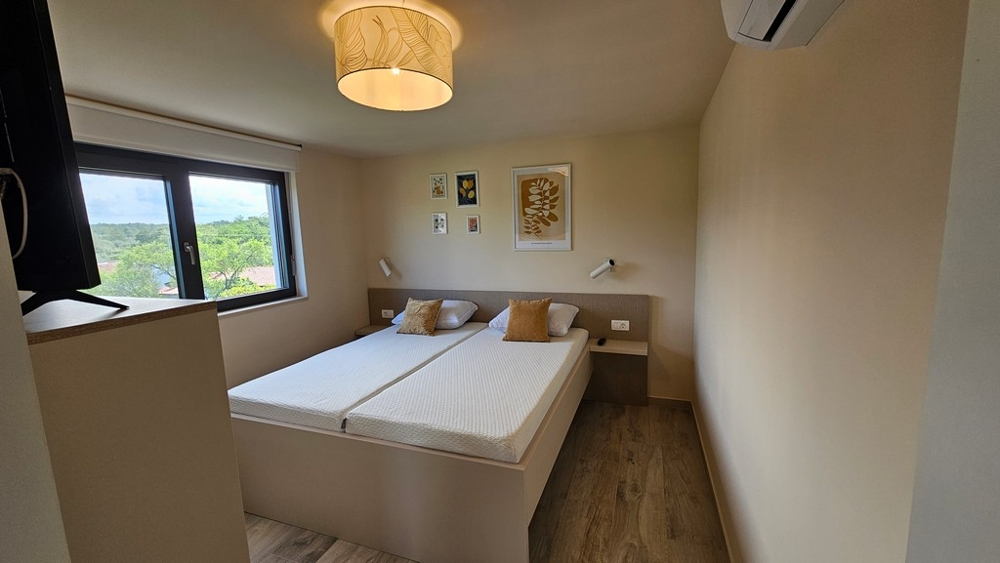 Bedroom with double bed and air conditioning