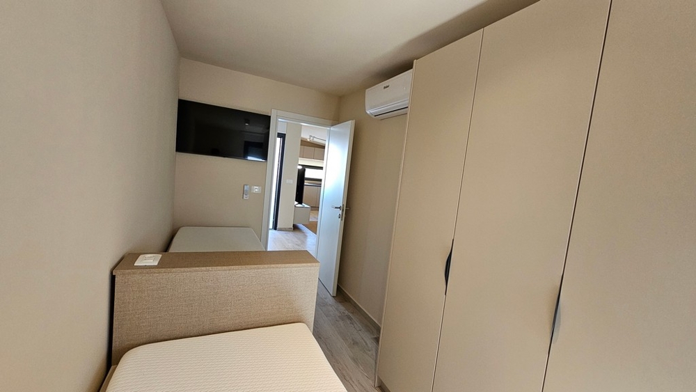 Small bedroom with built-in wardrobe