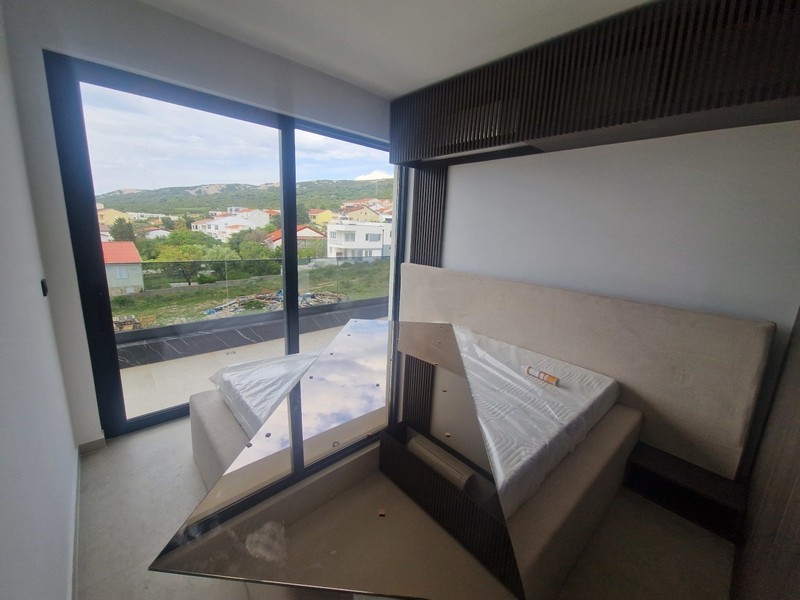 Bedroom with large window front