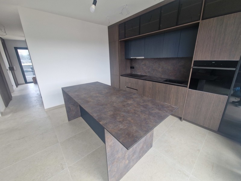 Kitchen with cooking island in new apartment