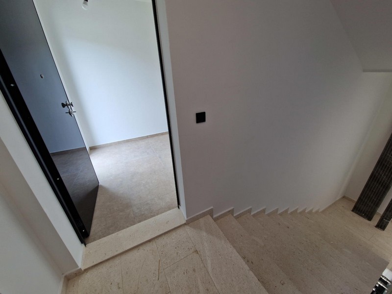 Staircase and entrance door.