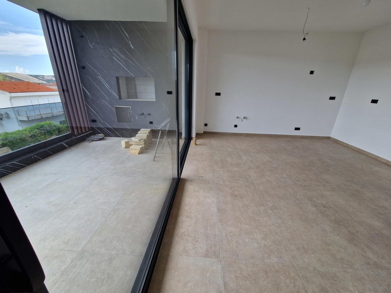 Living room and view of the terrace of apartment A3960 in Croatia.