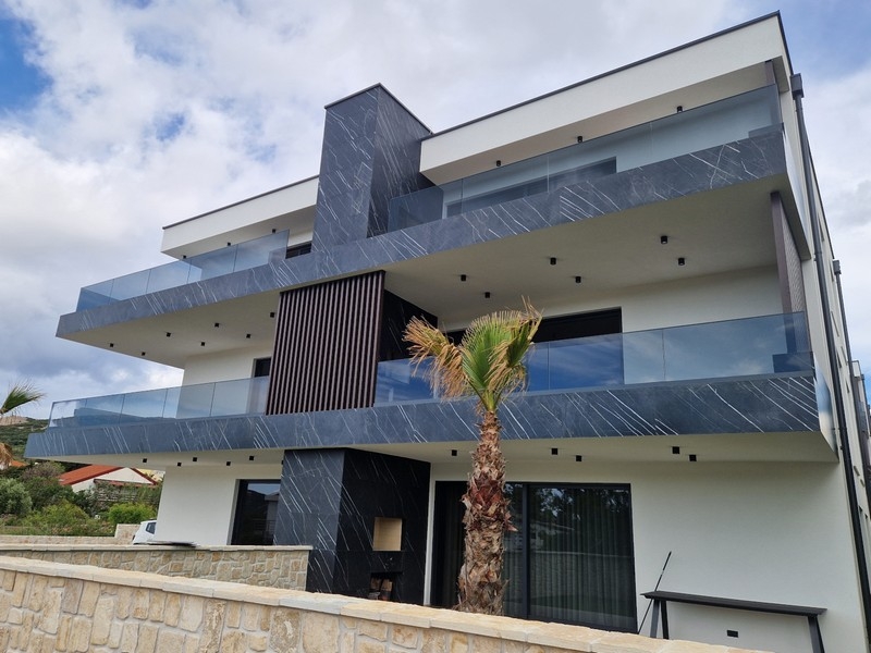 Modern residential building with glass balconies in Croatia