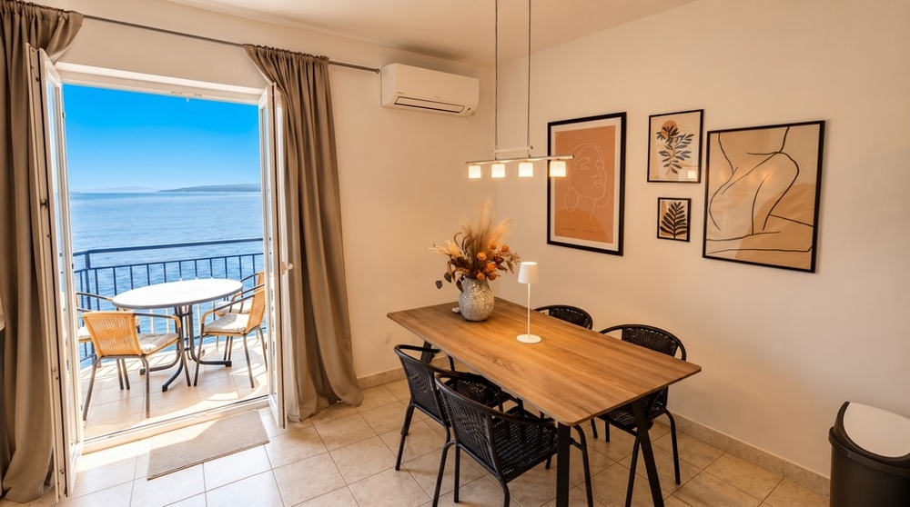 Living area with sea views and balcony access