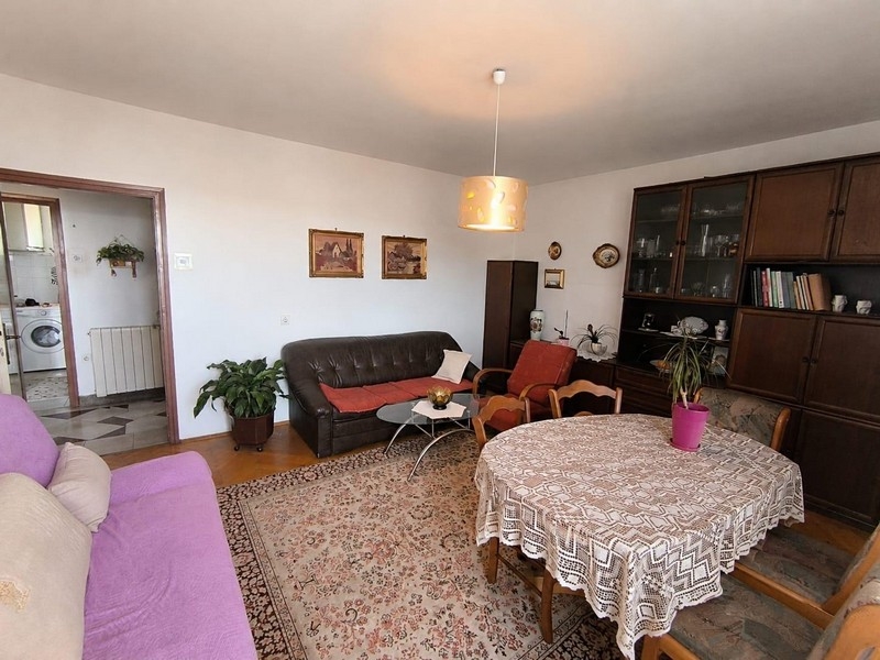 Living room with seating area and balcony