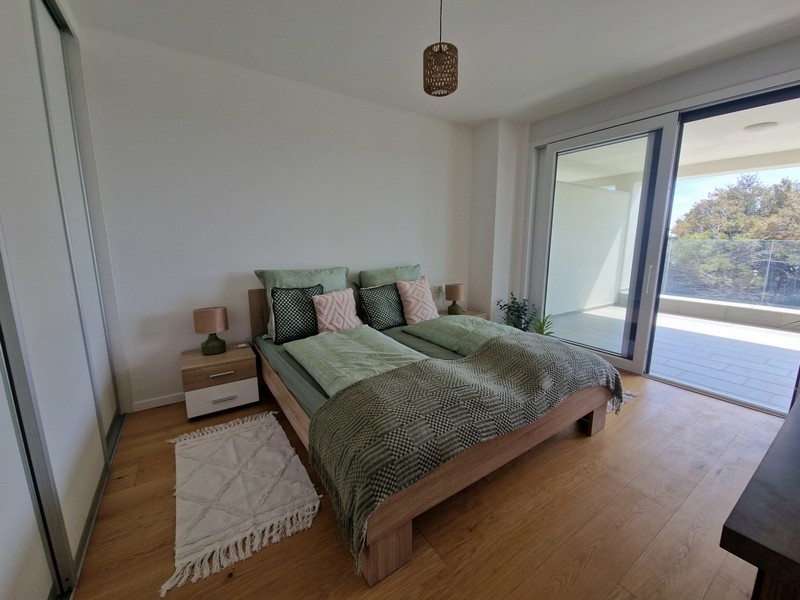 Bedroom with terrace and large windows