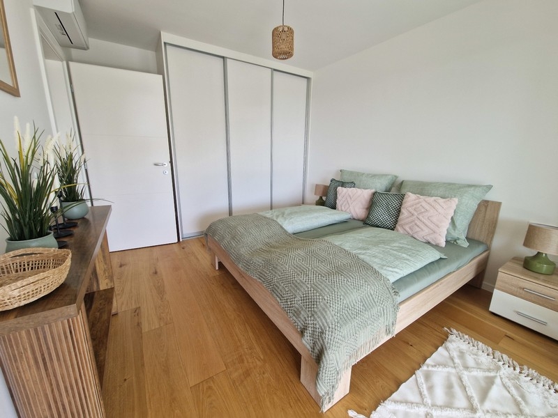 Bedroom with built-in wardrobe and balcony access