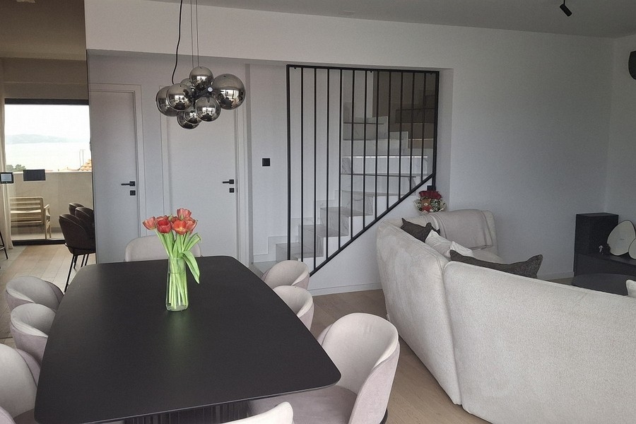 Open living area with stairs and dining area