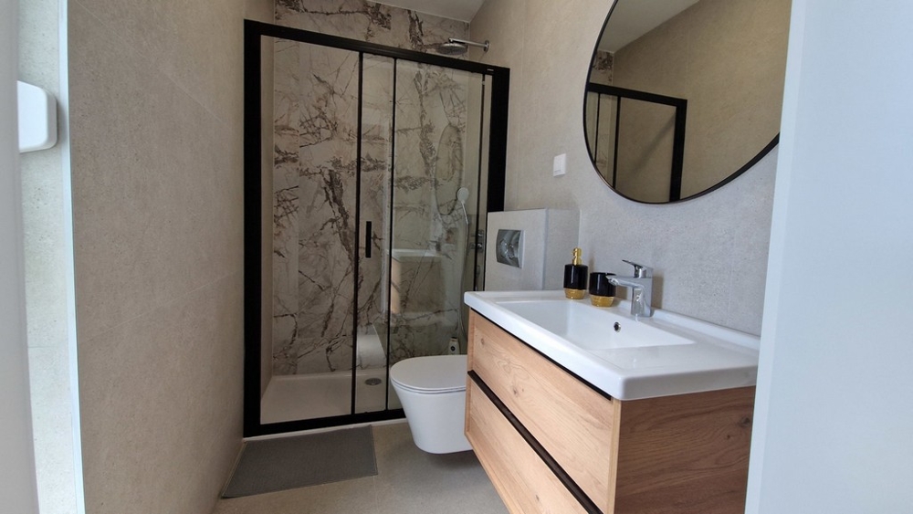 Modern bathroom with shower and vanity